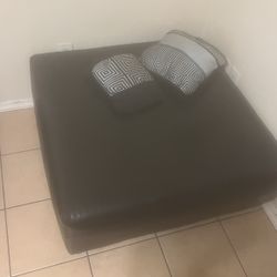 Black Ottoman Center Couch Piece with two pillows