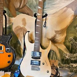 Electric guitar with gig bag strap and stand