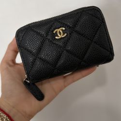 Used Chanel Classic Zipped Coin Purse, crafted in durable black quilted caviar leather with signature gold-tone hardware