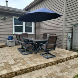 Patio Set Including 6 Swivel Rockers And Umbrella 