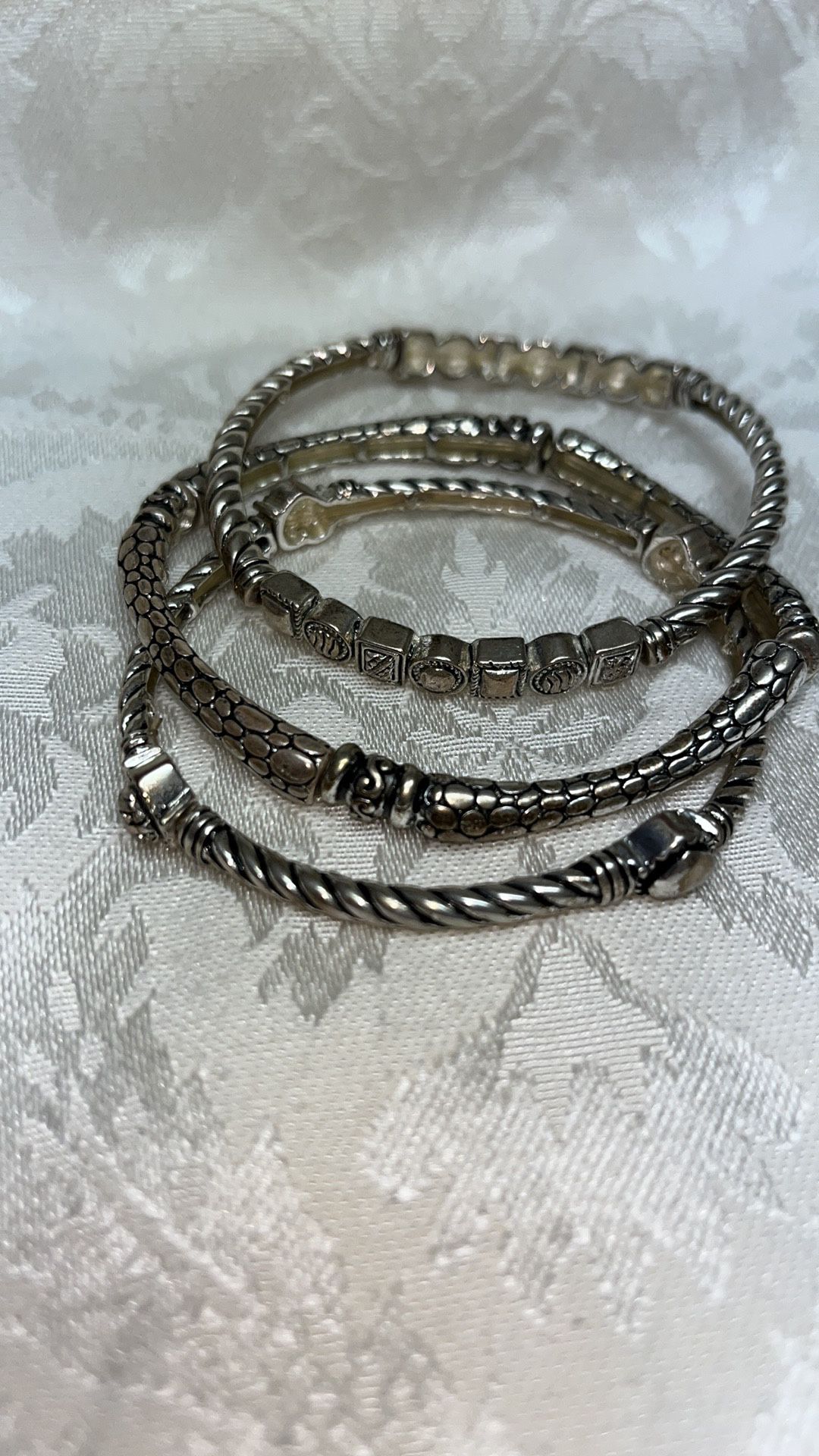 Set of 3 stretchy silver tone bracelets 