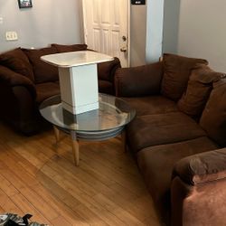 Brown Loveseat and Couch With Glass Table and an End Table For $150.00