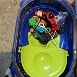 Lot of beyblades with areana