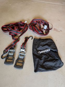Two Husky brand tie downs with bag. Like new