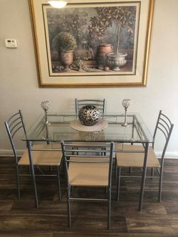 Like new glass dining table set with 4 chairs