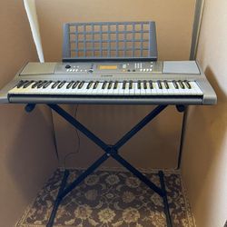 Yamaha YPT-310 Keyboard With AC Adaptor And Stand In Working Condition $100 Firm On Price