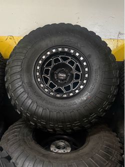 15” KMC Torq Black Machine finish 5x114 bolt pattern with 35” EFX Grippers