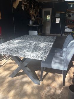 Granite Dining Table with 4 Gray Upholstered Chairs