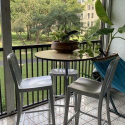 Table with chairs. Bar table. Bar stools. Aluminum chair.
