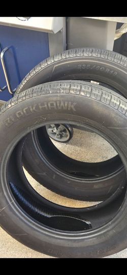 A pair of 235/60R18 BLACKHAWK Tires