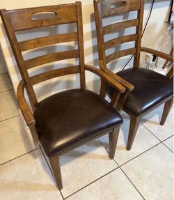 Pair of solid wood arm chairs