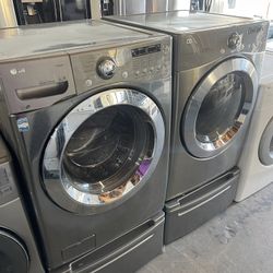 Lg Washer And Electric Dryer On Pedastool 