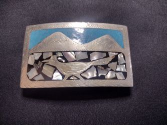 Silver belt buckle with turquoise and shield inlays