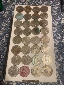 Lot of 32 damaged Eisenhower Dollar Coins, picked up from a storage unit