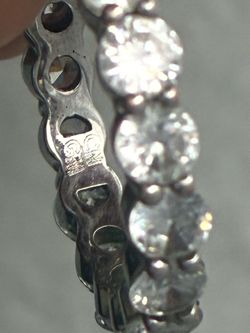 Womens crafted in highly polished 14K White Gold. Seventeen large brilliant round cut diamonds are prong set across the frame which weighs a total of 