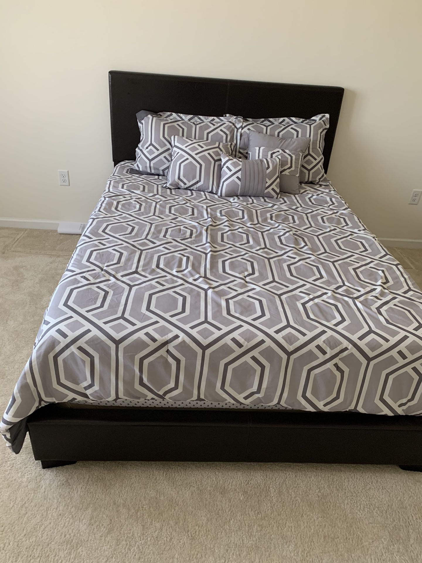 Queen bed frame with pillow top mattress and box spring. Bedroom.