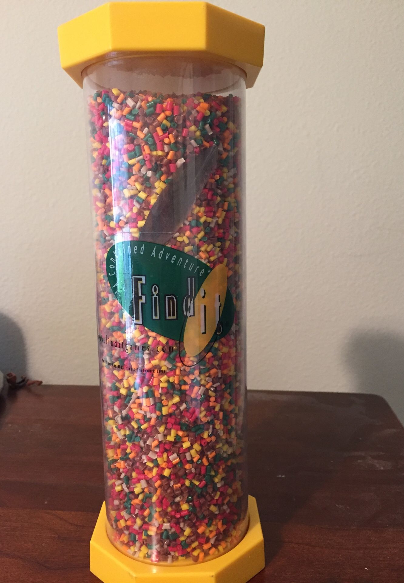 Find it! Enclosed with small beads and hidden little objects.