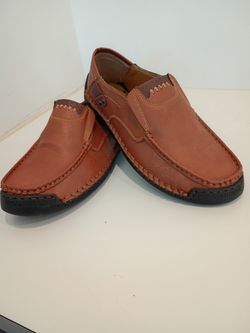 Caoutchouc slip-on moccasin loafers featuring contrasting stitching and a molded rubber outsole.