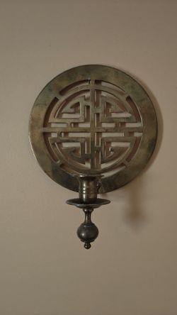 Brass Oriental wall candle holder