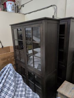 Room and board Walnut cabinet with glass doors. Retail price 3500. Only $400ea. 2 available. Matching. Pick up only no delivery. City of Orange