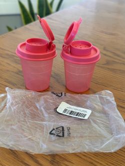 $12 - New Tupperware Midget Tupper Mini Salt and Pepper Shakers.  Pink Sheer Bases and Pink Shaker Seals.  2 Ounce Capacity Each - Approximately 2" D