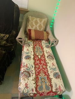 Chaise lounge with a full-length floral cushion