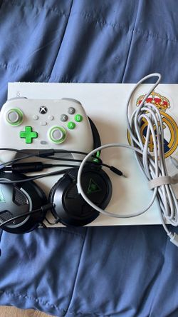Xbox one x with controller and mic with a 32 inch Roku tv