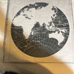 Wooden picture of globe.