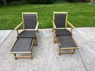 Pair of reclining Acadia wood chairs with retractable foot rest
