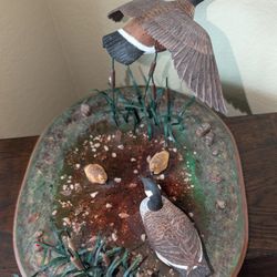Miniature Canadian Goose Family On A Pond