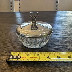 vintage crystal glass candy or vanity dish with a metal lid.