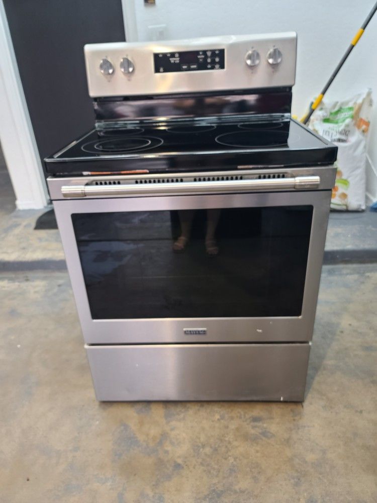 Maytag Stailess Steel Stove With Dent Shown On Picture