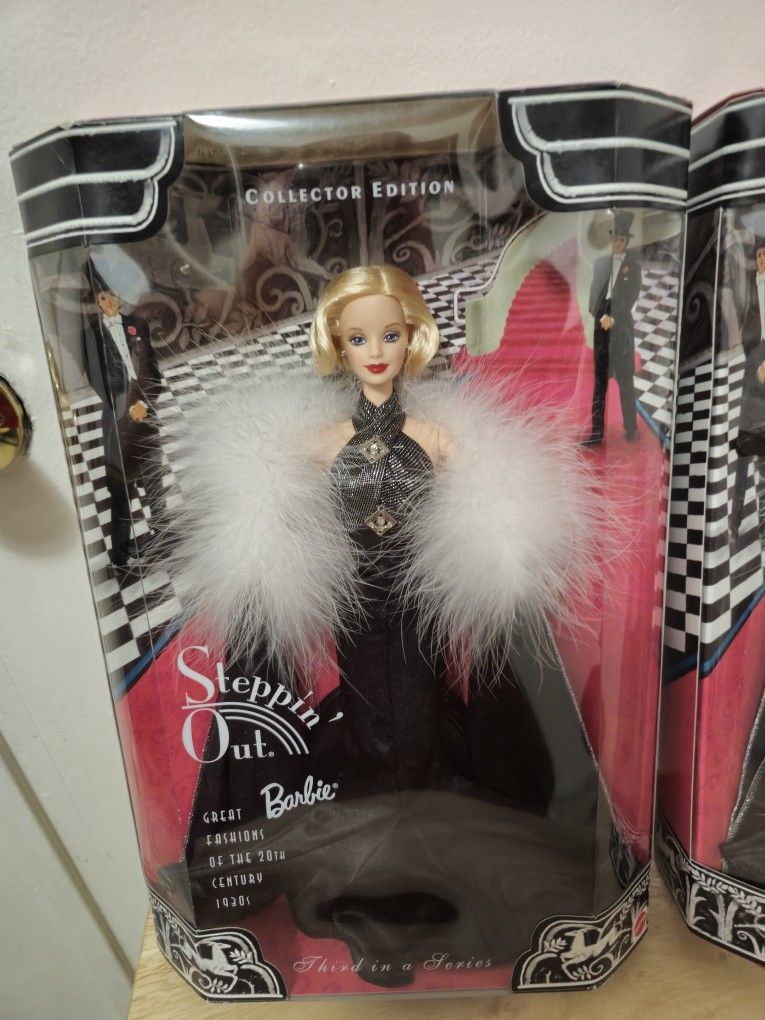 Vintage stepping out barbies.