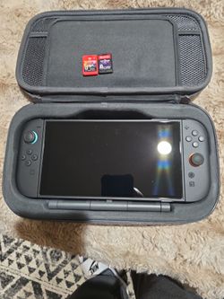 Nintendo switch 2 with charging case and wireless controller 3 games