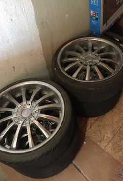 four 20inch chrome rims with tires One Missing Cap