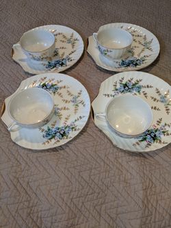 4 cups with four plates no name