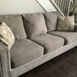 Gray Studded Sofa Bed Modern Couch With Pillows And Matching Chair