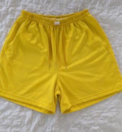 Bright yellow athletic shorts in great condition