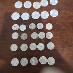 10 Mint 1oz Silver Rounds And 20 40% Silver Half Dollars.