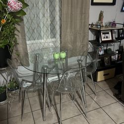 Glass Table 4 Chairs  Moving Out Need To LmSale Asap ….OBO