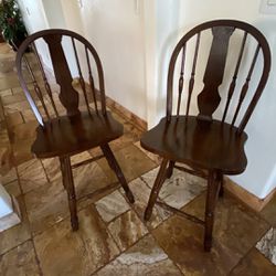 Two Wooden Swivel Chairs 