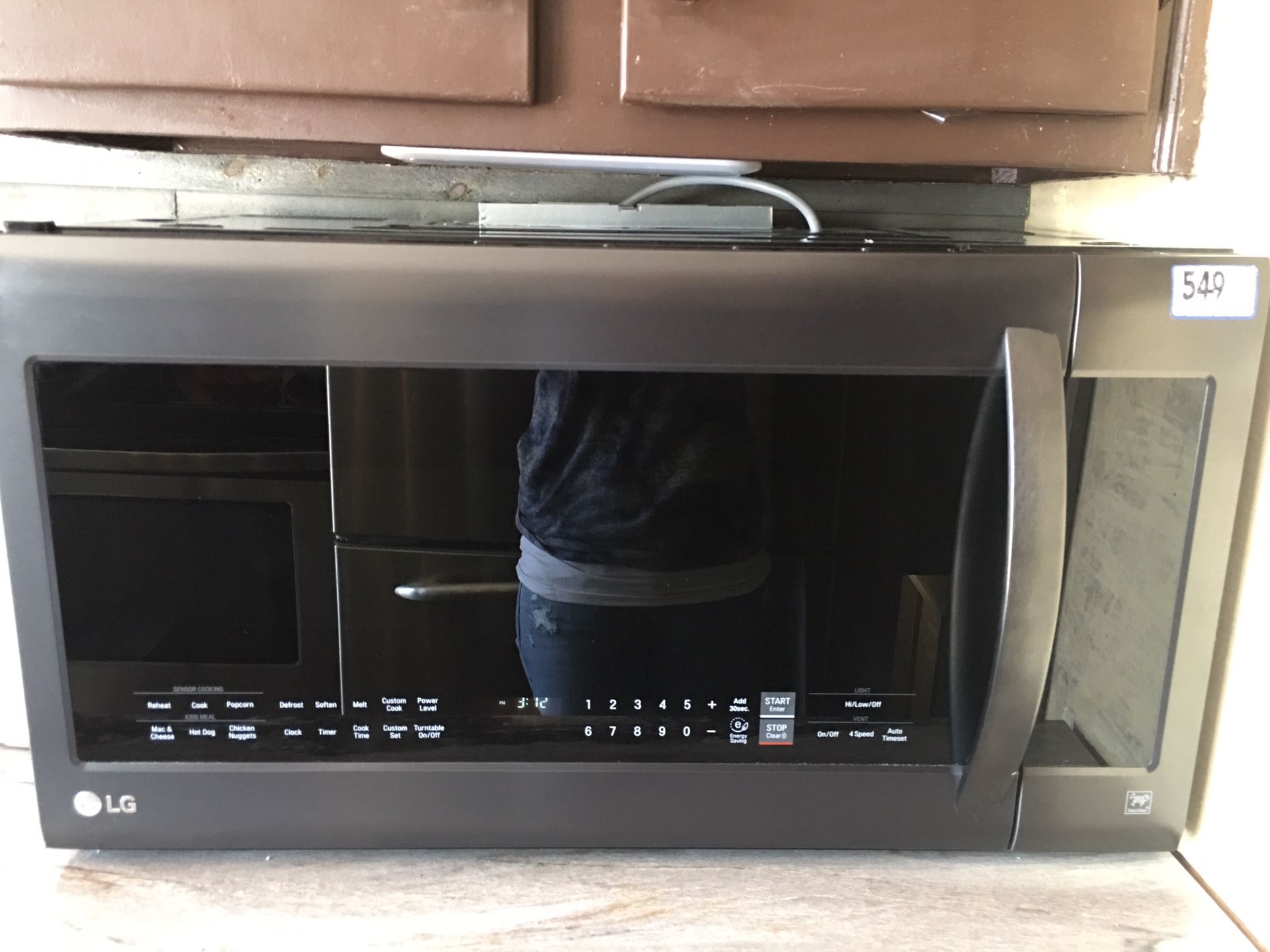 Black stainless LG microwave over the stove model