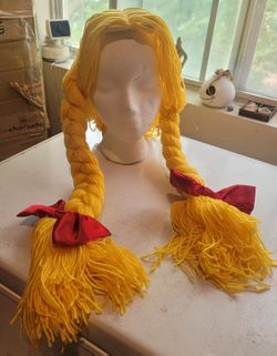 Yellow yarn wig with red bows Halloween costume 