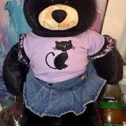 Build a bear black bear with a purple cat T-shirt and a blue denim skirt