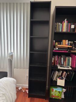 Narrow tall black shelf