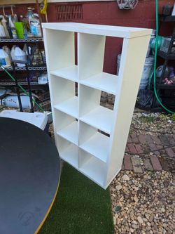 Cube 27 x 12 n 52 inch tall.  IKEA Kallax 2x4 Cube Shelving Unit