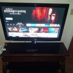Panasonic TV W/ Glass And Wood Stand 42' And Firestick