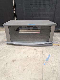 Gray Wood Composite TV Stand with Glass Doors