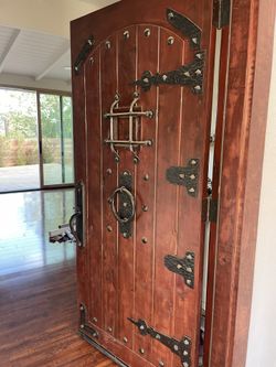 Mediterranean Knotty Alder Sq. Top Speakeasy Red Mahogony Stain Front Door