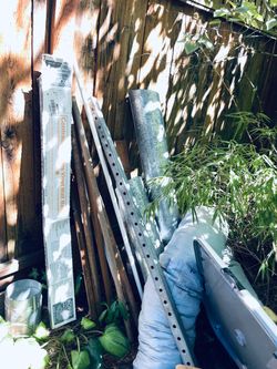HVAC ducting,  metal sheets, lawn chairs, push mower, wood dowels, electric extension cords,many metal fence brackets, sheets of metal, misc repair li